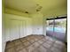 Bedroom with pool view and tile floors at 22105 Deer Pointe Xing, Bradenton, FL 34202