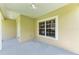 Covered patio with a window and neutral-colored walls at 4925 70Th E St, Palmetto, FL 34221