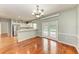 Dining room with hardwood floors, chandelier, and access to the pool at 4925 70Th E St, Palmetto, FL 34221