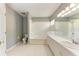 Bathroom with a shower/tub combo, double vanity, and tile flooring at 4925 70Th E St, Palmetto, FL 34221