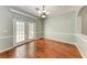Bright dining room with hardwood floors, chandelier, and French doors at 4925 70Th E St, Palmetto, FL 34221