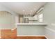 Kitchen boasts white cabinets, stainless steel appliances, and a breakfast bar at 4925 70Th E St, Palmetto, FL 34221