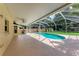 Inviting screened pool area with patio and backyard access at 4925 70Th E St, Palmetto, FL 34221