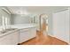 Eat-in kitchen with white cabinets, stainless steel appliances, and hardwood floors at 4925 70Th E St, Palmetto, FL 34221
