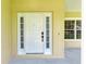 White front door with sidelights and a traditional design at 4925 70Th E St, Palmetto, FL 34221