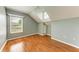 Bright bedroom featuring a window, wood floors, and built-in shelving at 4925 70Th E St, Palmetto, FL 34221