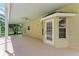 Covered patio adjacent to a refreshing pool at 4925 70Th E St, Palmetto, FL 34221