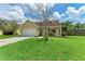 House exterior showcasing a well-maintained lawn and a two-car garage at 4925 70Th E St, Palmetto, FL 34221