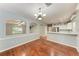 Dining room features hardwood floors, a chandelier and views into the living room at 4925 70Th E St, Palmetto, FL 34221