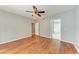 Bedroom with wood floors, a ceiling fan, and an en-suite bathroom at 4925 70Th E St, Palmetto, FL 34221