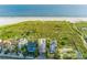 Beachfront property with a unique home design, pool, and ocean views at 648 Beach Rd, Sarasota, FL 34242