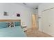 Bright bedroom with a comfy bed, accent wall decor, and double door closet at 12198 Longview Lake Cir, Bradenton, FL 34211
