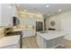 Bright kitchen with stainless steel appliances, center island and light cabinets at 12198 Longview Lake Cir, Bradenton, FL 34211