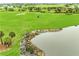 Aerial view of green space, golf course, and lake at 14671 Derna Ter, Bradenton, FL 34211