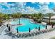 Resort-style pool with plenty of lounge chairs and umbrellas at 14671 Derna Ter, Bradenton, FL 34211