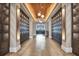 Barrel House wine room entrance with lockers and wood flooring at 15655 Sacile Ln, Lakewood Ranch, FL 34211