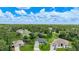 Scenic aerial view of multiple homes with mature trees at 2204 Chipley Ave, North Port, FL 34286