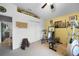 Exercise room with work out equipment, natural light from a window, and ceiling fan at 2204 Chipley Ave, North Port, FL 34286
