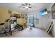 Exercise room with ceiling fan and natural light from a bright window at 2204 Chipley Ave, North Port, FL 34286