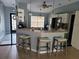 Bright kitchen featuring a breakfast bar with barstools, tile flooring, and stainless steel appliances at 2204 Chipley Ave, North Port, FL 34286