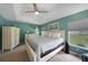 Serene main bedroom with tray ceilings, soft carpeting, and a bright window showcasing the outdoor view at 2204 Chipley Ave, North Port, FL 34286