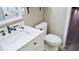 Bathroom featuring a vanity with white countertop, modern fixtures, and a toilet with neutral walls at 5415 5Th N Ave, St Petersburg, FL 33710