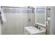 Bright bathroom features a shower with tiled walls, modern vanity with white countertop, and updated fixtures at 5415 5Th N Ave, St Petersburg, FL 33710
