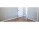 Bedroom with new wood-look floors and freshly painted gray walls ready for new occupants at 5415 5Th N Ave, St Petersburg, FL 33710