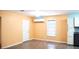Kitchen area with white cabinets, and stainless steel dishwasher and oven with a light blue wall at 5415 5Th N Ave, St Petersburg, FL 33710