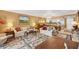 Living room with off-white couches and a floral patterned rug at 101 S Gulfstream Ave # 4A, Sarasota, FL 34236