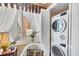 Convenient laundry closet with a stacked washer and dryer at 101 S Gulfstream Ave # 4A, Sarasota, FL 34236