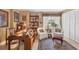 Bright home office with built-in bookshelves and comfortable seating at 101 S Gulfstream Ave # 4A, Sarasota, FL 34236