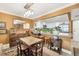 Bright dining area with wood table and kitchen pass-through at 101 S Gulfstream Ave # 4A, Sarasota, FL 34236