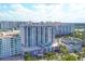 Aerial view of a high-rise building with a pool at 101 S Gulfstream Ave # 4A, Sarasota, FL 34236