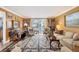 Elegant living room with ornate rug and built-in bookshelves at 101 S Gulfstream Ave # 4A, Sarasota, FL 34236