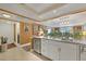 Open kitchen features granite countertops and white cabinetry at 101 S Gulfstream Ave # 4A, Sarasota, FL 34236