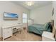 Bright bedroom with a desk, chair, and a bed at 12198 Longview Lake Cir, Bradenton, FL 34211