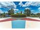 Community gathering space with star-shaped paved design and lush landscaping at 12198 Longview Lake Cir, Bradenton, FL 34211