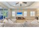 Bright living room with large sectional sofa and plantation shutters at 12198 Longview Lake Cir, Bradenton, FL 34211