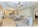 Open-concept living room with tile flooring and kitchen views at 12198 Longview Lake Cir, Bradenton, FL 34211