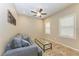 Cozy den with a comfortable couch and glass coffee table at 12198 Longview Lake Cir, Bradenton, FL 34211