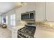 Modern kitchen with stainless steel appliances and light-colored cabinetry at 12198 Longview Lake Cir, Bradenton, FL 34211