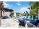 Stunning pool area with a spa, pergola, and plenty of seating at 11213 Riverview Dr, Riverview, FL 33578