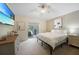 Bright bedroom with large bed, dresser, and sliding door to patio at 2204 Chipley Ave, North Port, FL 34286