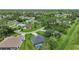 Aerial view of houses with a neighborhood and lush green landscaping at 2204 Chipley Ave, North Port, FL 34286