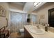 Clean bathroom with single sink vanity, shower, and toilet at 2204 Chipley Ave, North Port, FL 34286