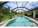 Spacious pool area with screened enclosure at 2204 Chipley Ave, North Port, FL 34286