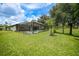 Expansive backyard with pool and lush lawn at 2204 Chipley Ave, North Port, FL 34286