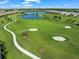 Picturesque golf course with a scenic pond and walking paths at 15655 Sacile Ln, Lakewood Ranch, FL 34211