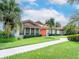 Condo exterior with walkway and lush landscaping at 4068 Wilshire E Cir # 145, Sarasota, FL 34238